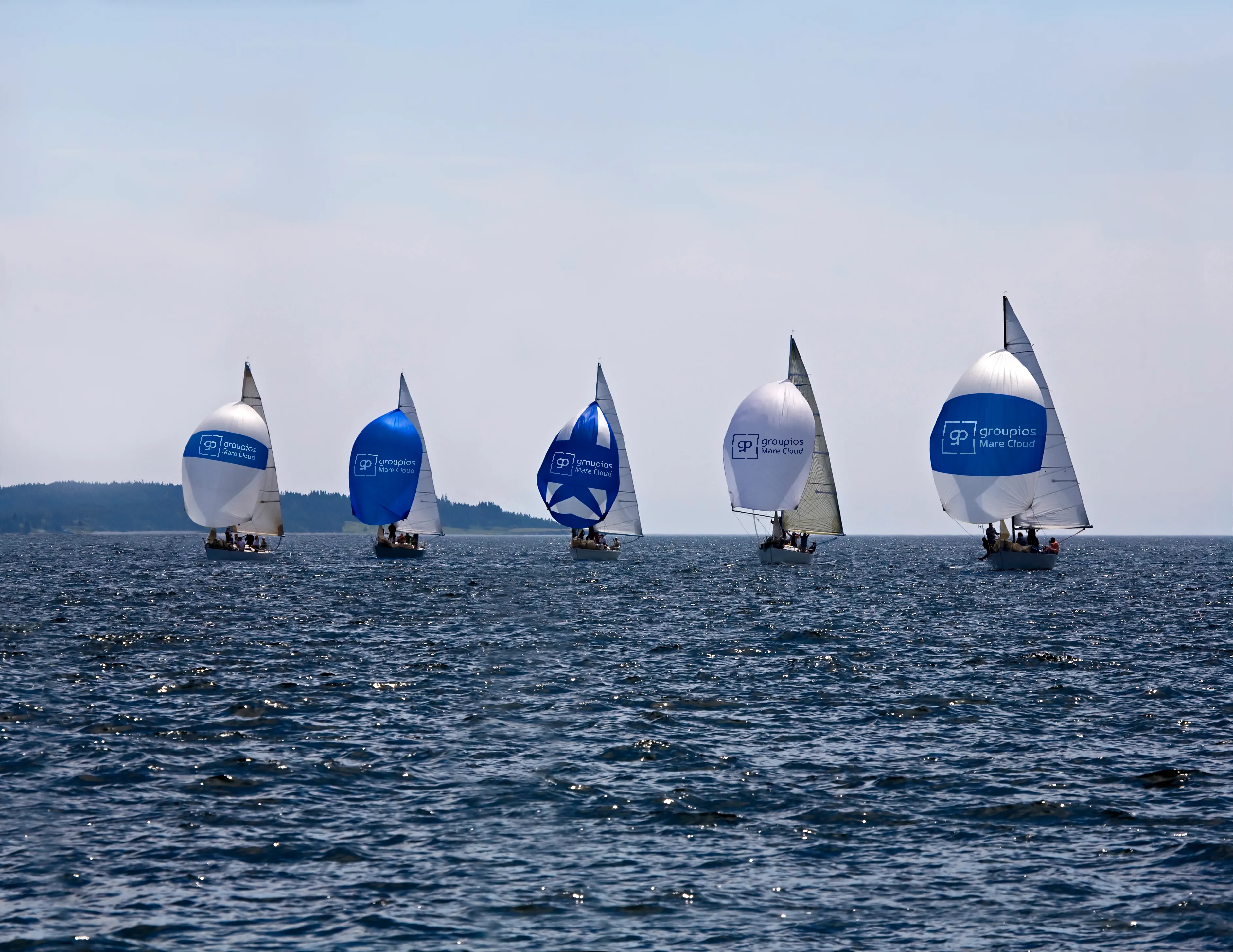 Multiple sailboats at sea - a symbol for distributed, independent data nodes